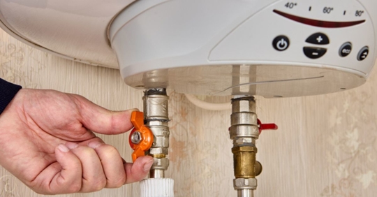 hand adjusting water heater